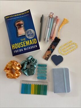 The Housemaid by Freida McFadden - Blue Paperback and accessories